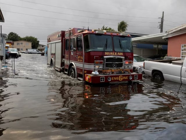 fire truck drives through flood water at a trailer park community in hialeah florida u s november 16 2023 photo reuters